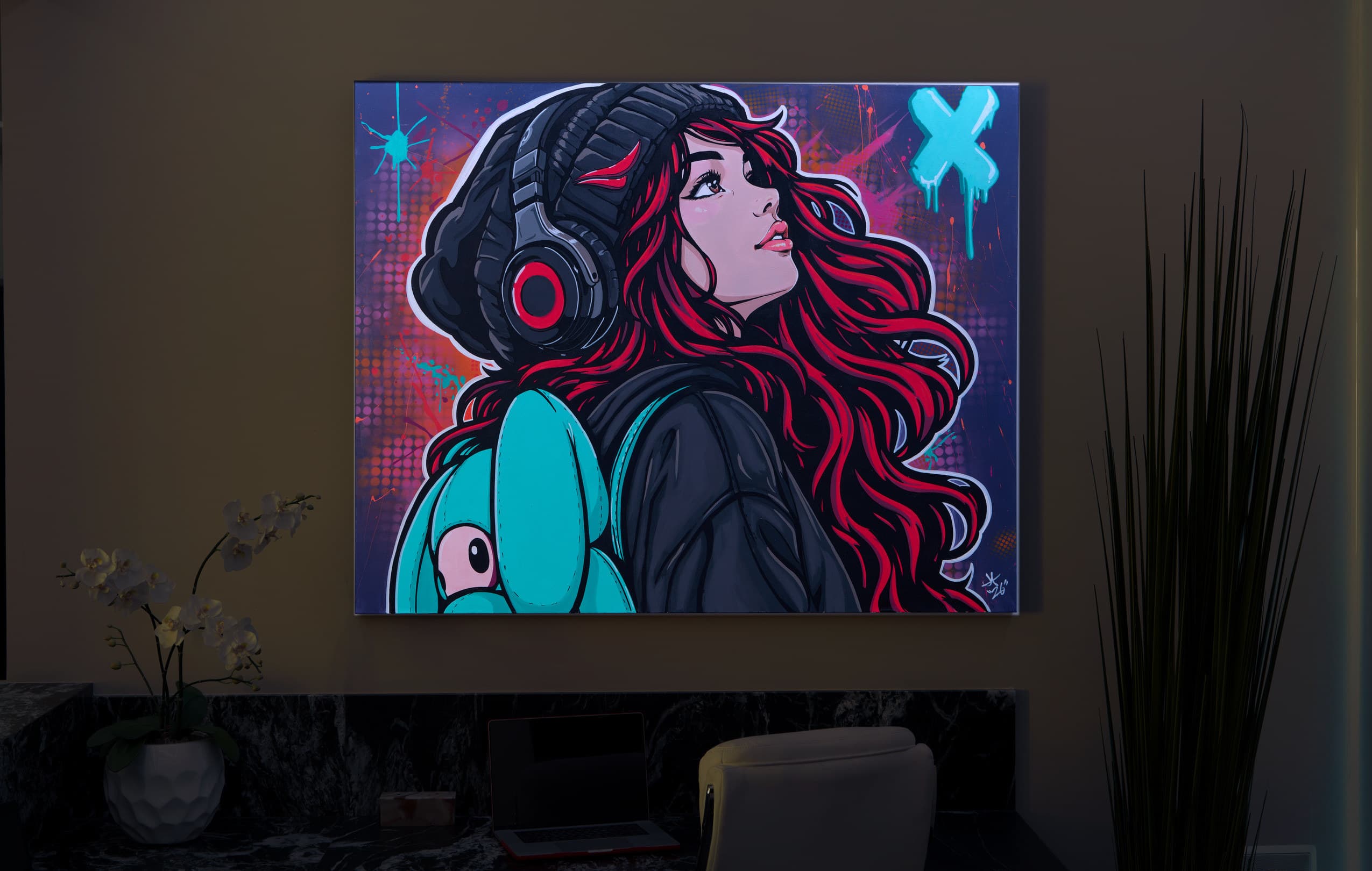 Colorful headphone portrait artwork precisely illuminated in the Eagle Sentry showroom