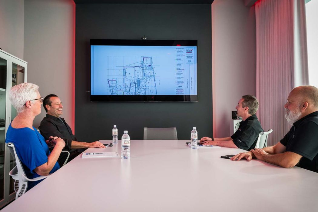 people sitting at a table discussing work